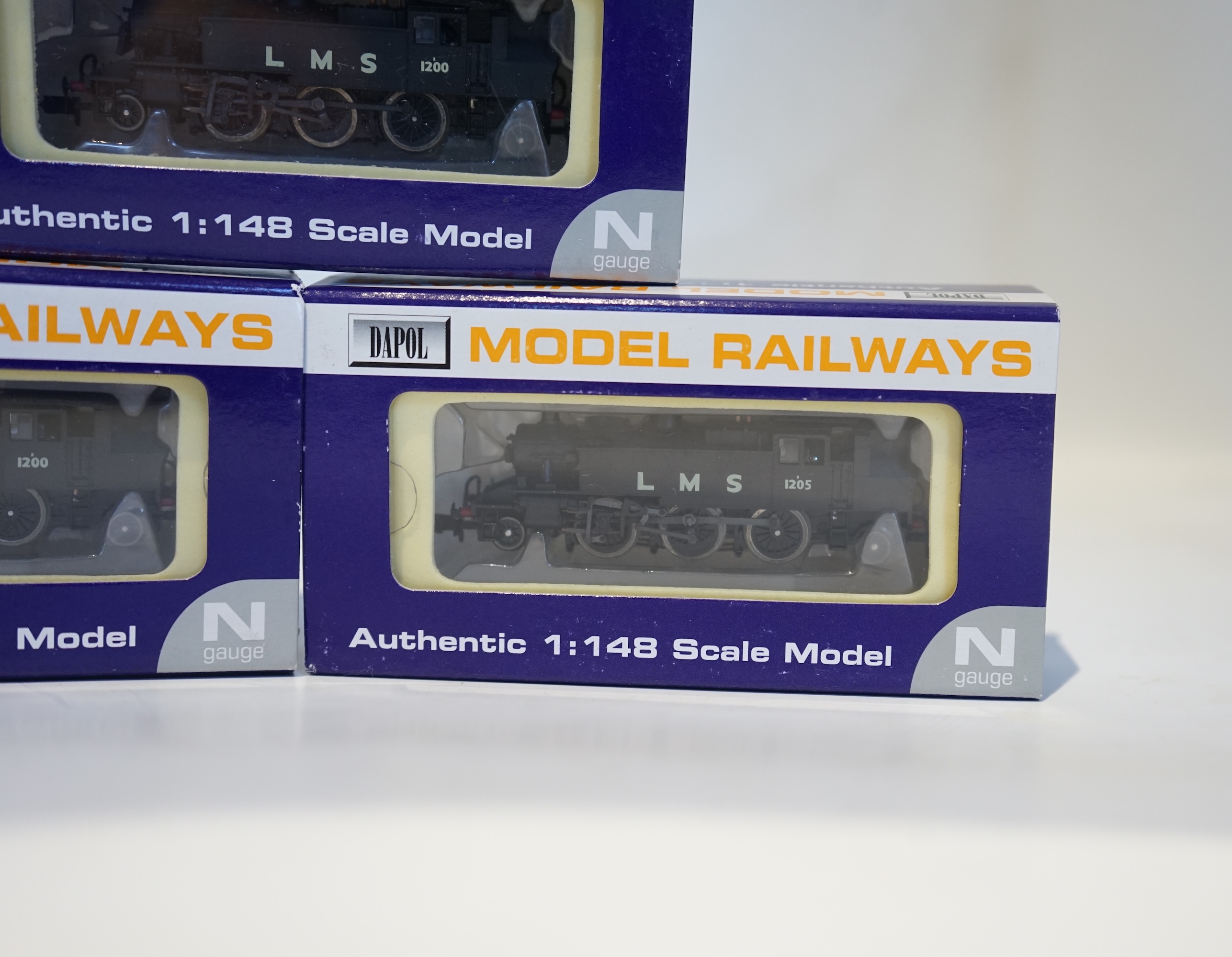 Three boxed Dapol N gauge railway LMS Ivatt 2-6-2T locomotives; 1205 (ND-062B), 1200 (ND-062A), and 1200 (ND-062A). Condition - good.